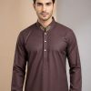 Eid Collection 2026 Burgundy Custom designed Panjabi by SAWIAA Bangladesh A regular-fit traditional outfit crafted from 100% Pakistani cotton fabric, featuring intricate Zardozi embroidery with French knots and dabka work